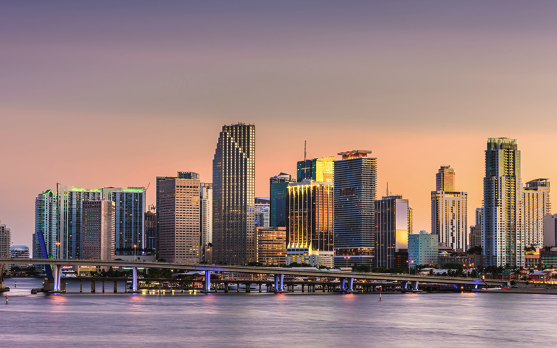 Miami skyline showing buildings and bridge where the principle office of the hamptons group is located.